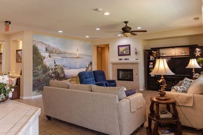 Comfortable common area with seating and mural.