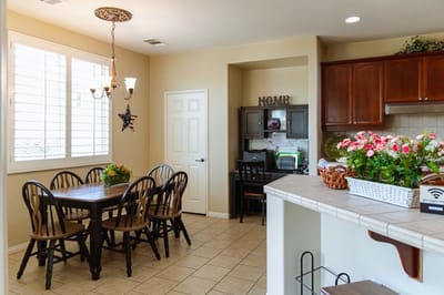 Bright dining area with a table and plants