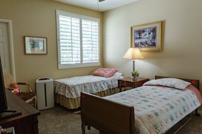 Cozy shared resident room with two beds.