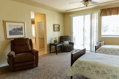 Cozy shared resident room with two beds.