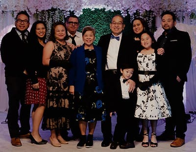 Group photo of a family celebration indoors.