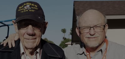 Two seniors enjoying time outdoors together.