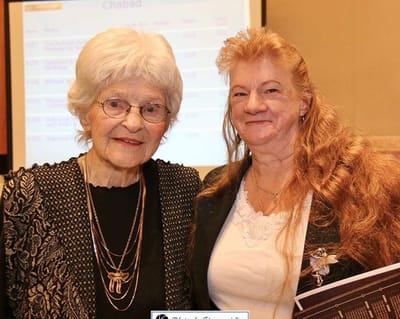 Two women celebrating a special event together.