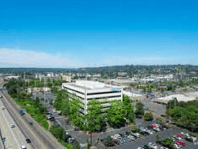 Aerial view of a building and parking area.
