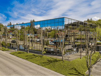 Modern assisted living facility exterior with reflective glass
