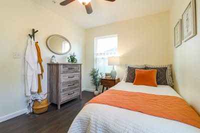 Cozy resident bedroom with a warm color scheme