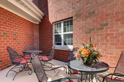 Outdoor patio area with tables and chairs