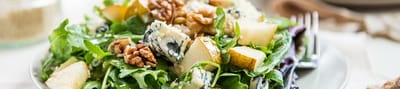 A fresh salad with nuts and fruit