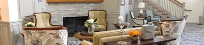 Cozy common area with seating and decorative elements.
