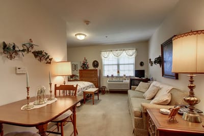 Cozy resident room with furniture and decorations.
