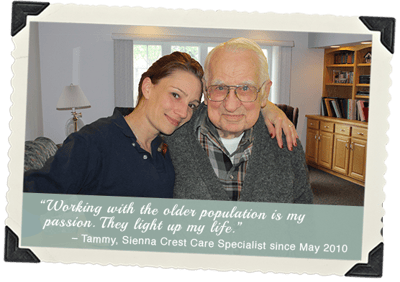 Care specialist with elderly resident in a cozy room