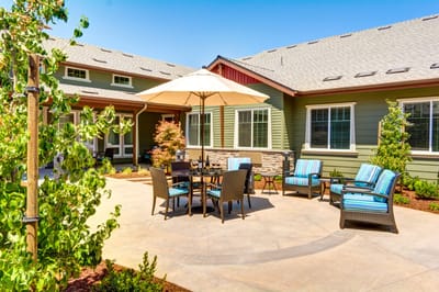 Outdoor seating area with tables and umbrellas
