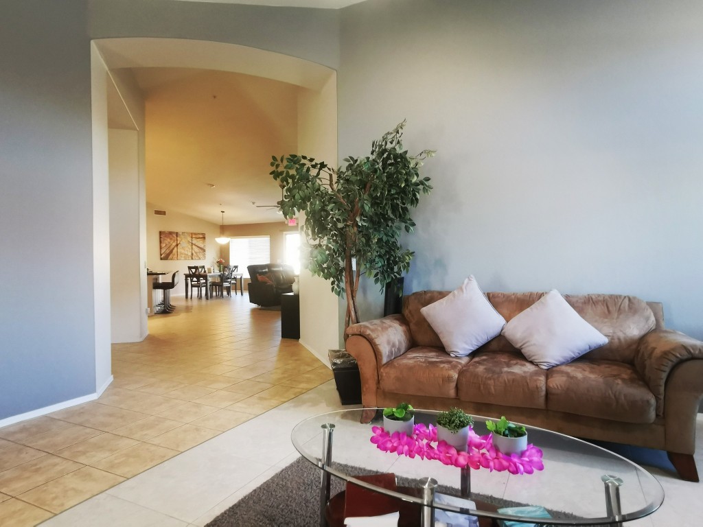 Interior common area with a cozy couch and plants