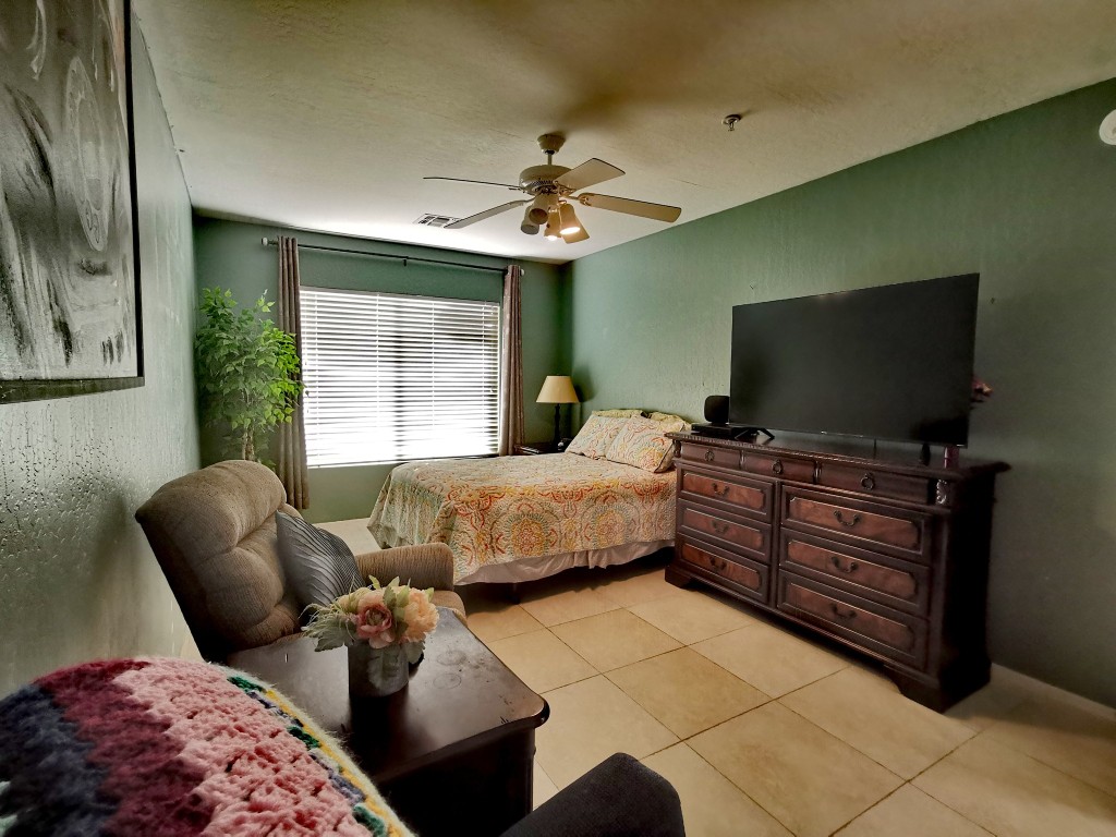 Cozy resident room with a bed and seating area