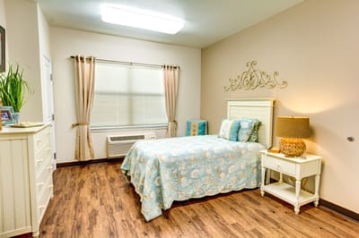 Cozy private bedroom with a neatly made bed