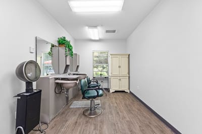 Interior view of a salon area with styling chairs