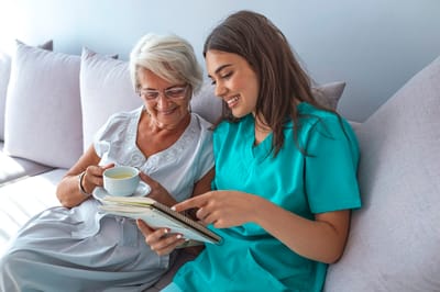 Caregiver sharing a joyful moment with a senior resident