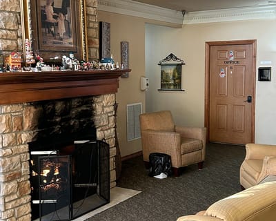 Cozy interior of a common area with a fireplace
