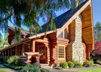 Exterior view of a log cabin-style adult family home