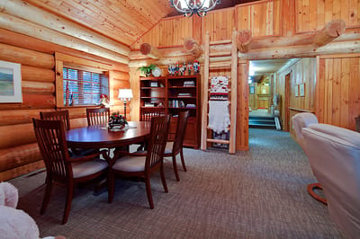 Cozy common area with wooden accents and dining table