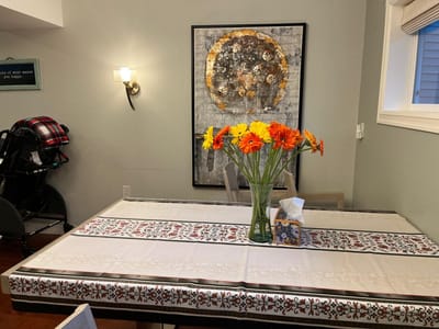 Dining table with a floral centerpiece in a common area