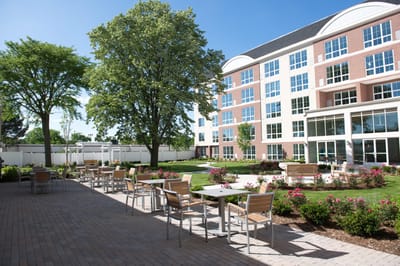 Outdoor patio area with seating and landscaping