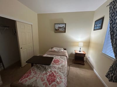 A simple, furnished resident room in a nursing facility