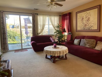 Bright common area with sofas and a table