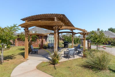 Outdoor pergola seating area in a senior living community