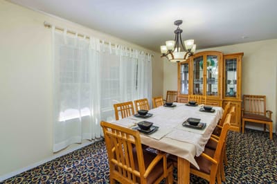 Bright dining room setup with a large table and chairs