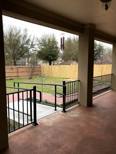View of a peaceful garden from a covered porch