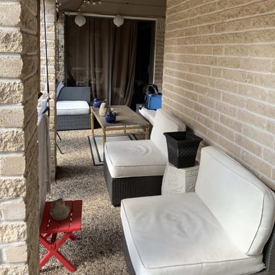 Outdoor seating area with couches and decor