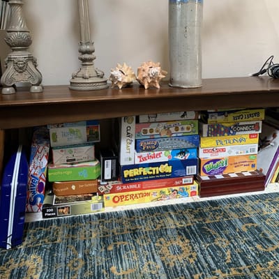 Games stored on a shelf in a common area