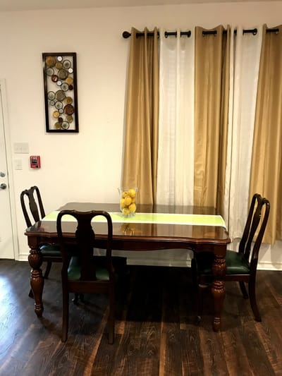 A dining table with chairs and decorative elements