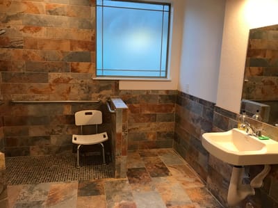 Accessible bathroom with safety features and seating
