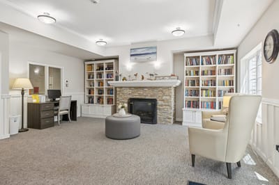 Cozy common area with bookshelves and seating