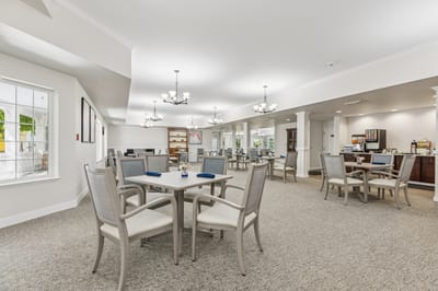 Bright dining area with tables and chairs