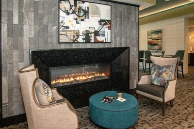 Cozy interior lounge with fireplace and artwork