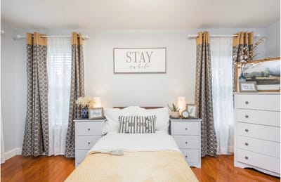 Brightly decorated resident room with cozy furnishings