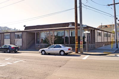 Exterior view of the facility with parked cars