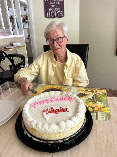 Resident celebrating birthday with a cake