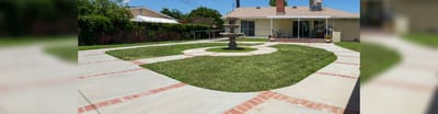 Well-kept outdoor garden and patio area.