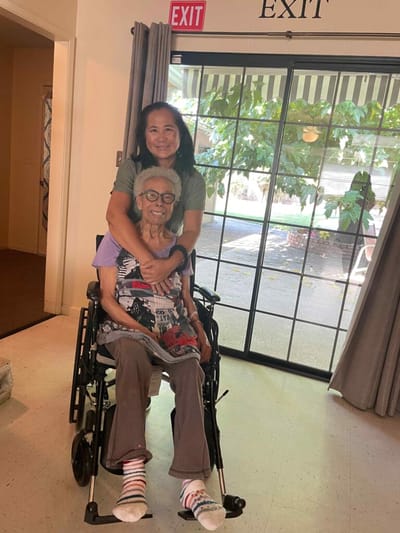 Staff member embracing a resident in a common area