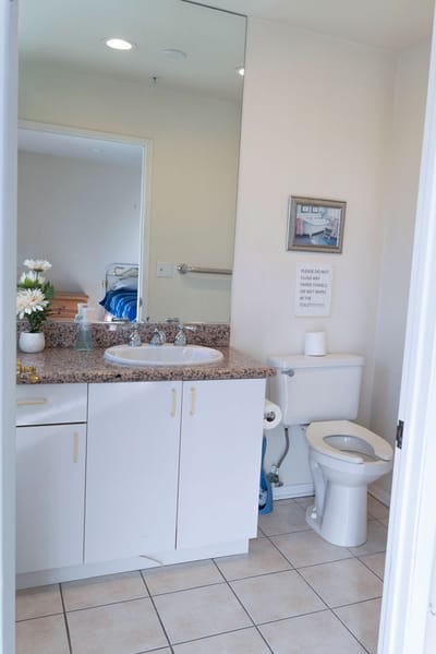 Clean bathroom with sink and toilet setup.