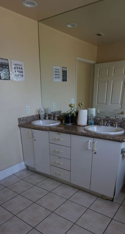 Bathroom with double sinks and mirrors