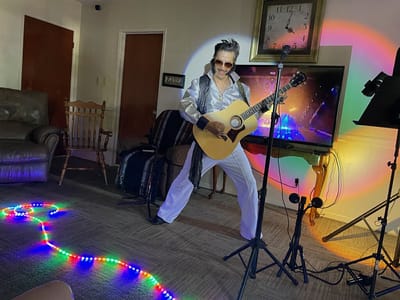 Performer entertaining residents in a common area