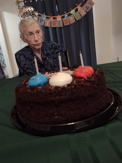 Resident celebrating with a birthday cake.