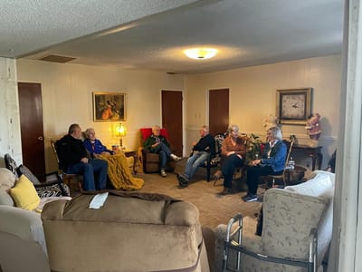 Residents socializing in a common area of the facility.