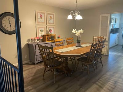 Warm dining area with wooden table and chairs