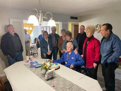 Residents celebrate with cake at a birthday party.
